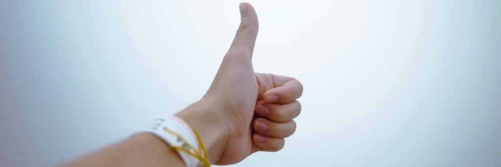 Hand giving thumb-up