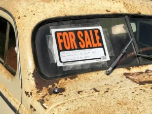 For Sale Sign on Rursty Car