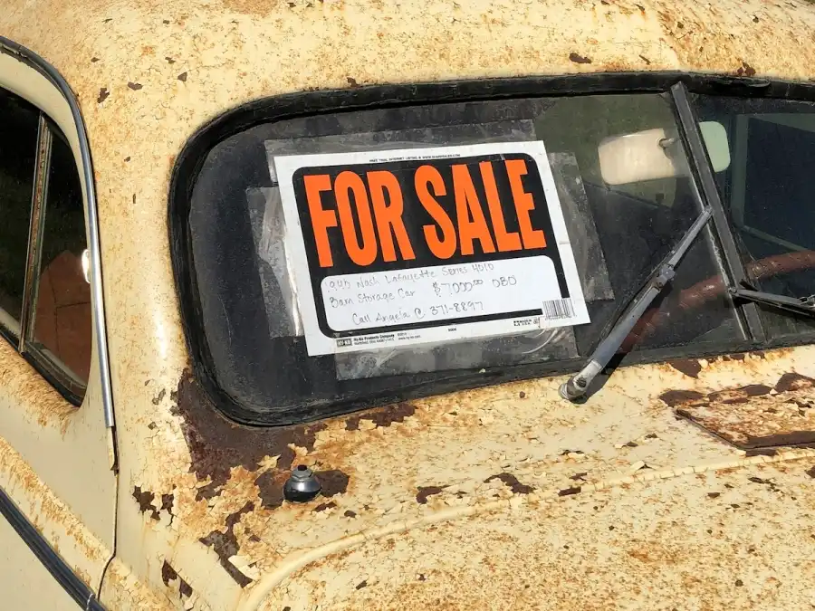 For Sale Sign on Rursty Car